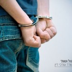 10877250 - young man in handcuffs